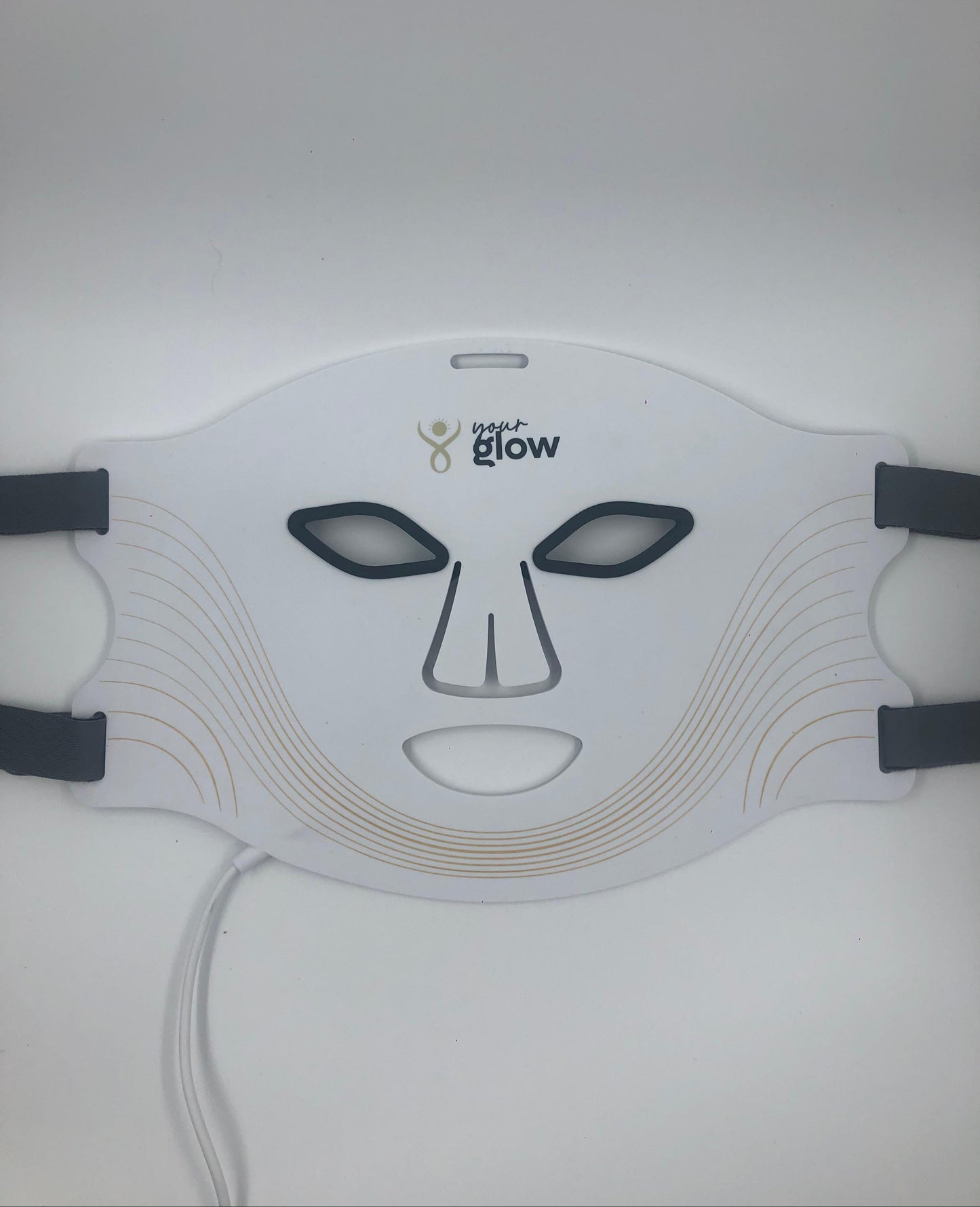 White YourGlow LED face mask with black straps on a white background