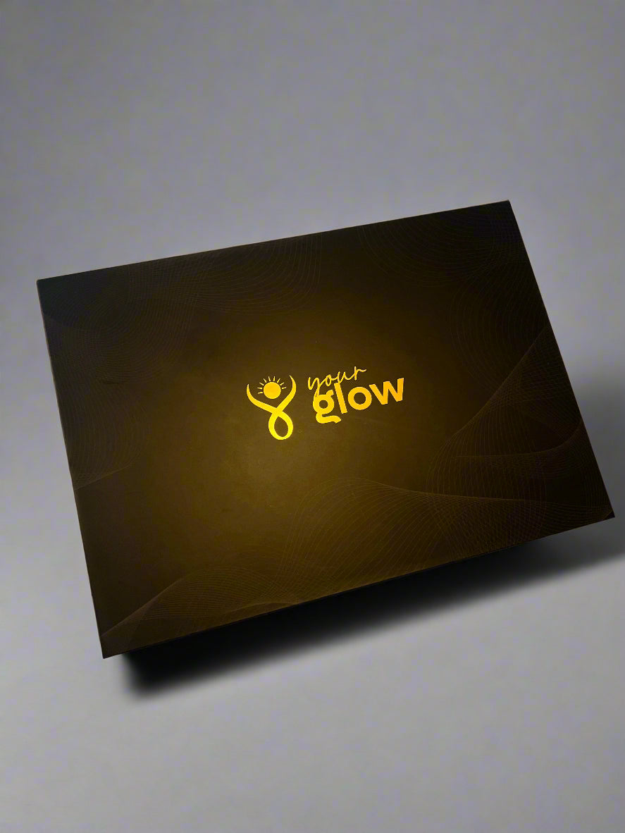 Black box with 'your glow' logo on a light-colored surface